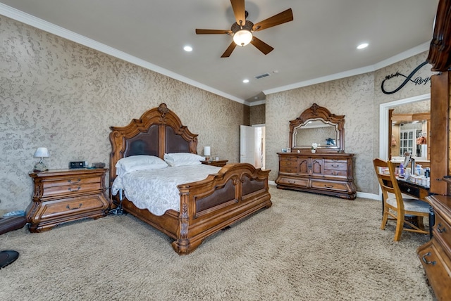 carpeted bedroom with ceiling fan and ornamental molding