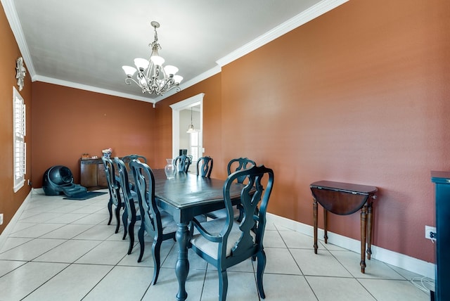 dining space with light tile patterned flooring, a chandelier, and ornamental molding