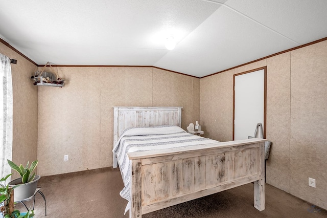 bedroom featuring dark colored carpet, ornamental molding, and lofted ceiling