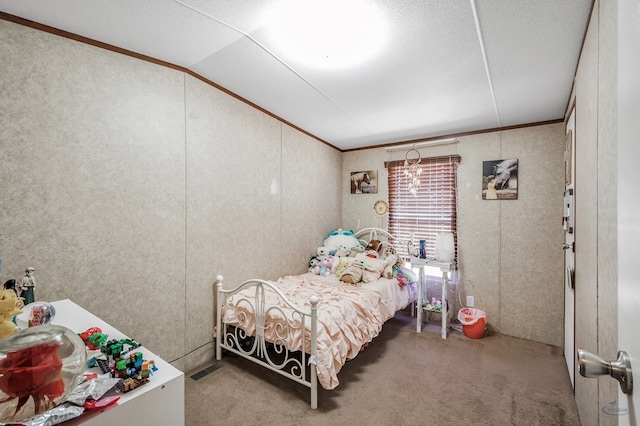 bedroom featuring carpet, lofted ceiling, and ornamental molding