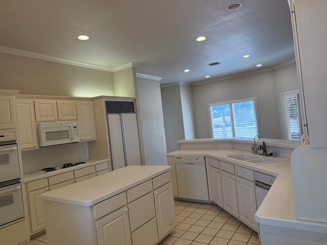 kitchen featuring white appliances, light tile patterned floors, light countertops, crown molding, and a sink