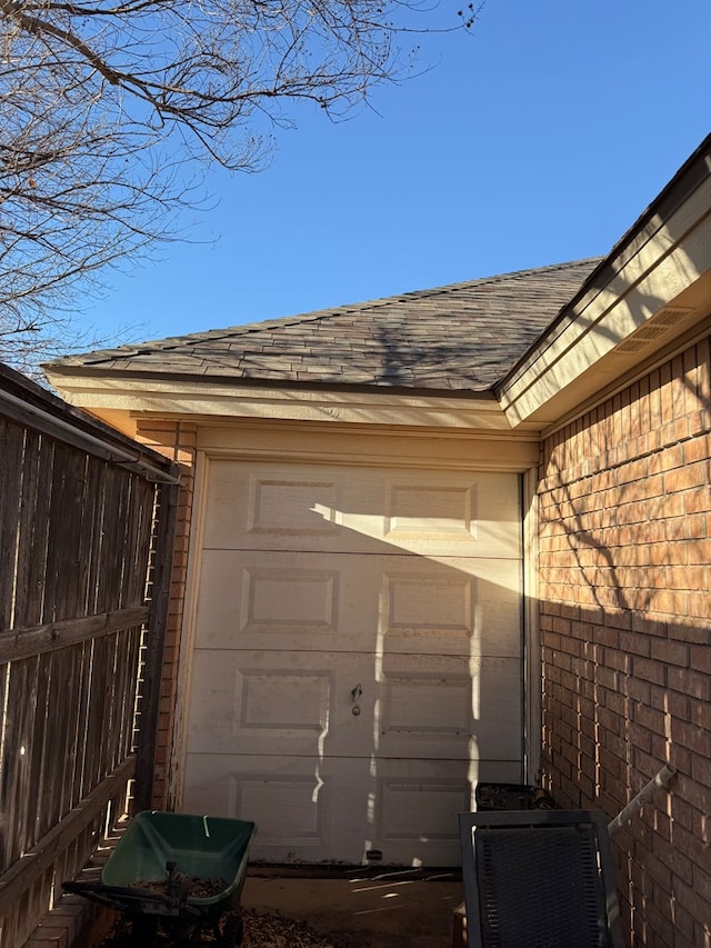 garage featuring fence