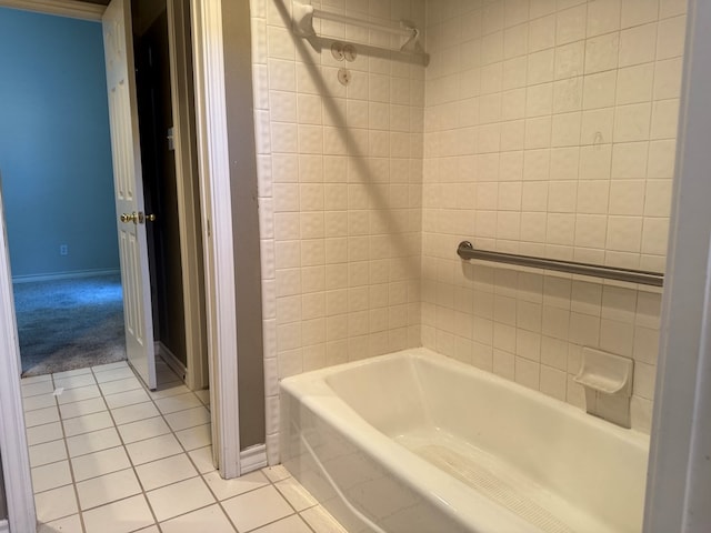 full bath featuring baseboards and tile patterned floors