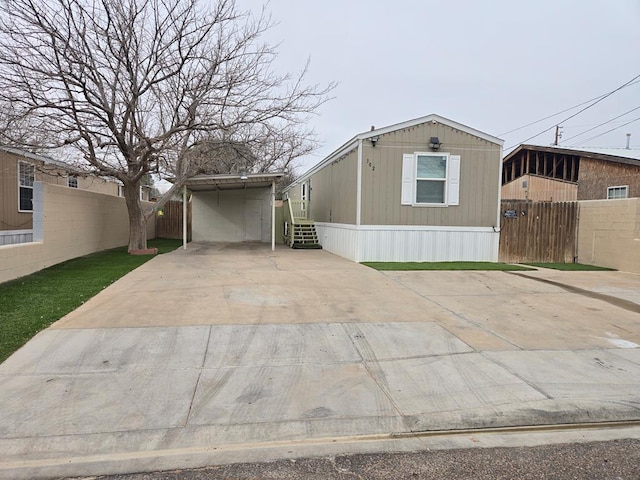 view of front of property featuring a carport