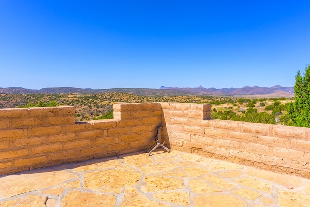 view of patio / terrace with a mountain view