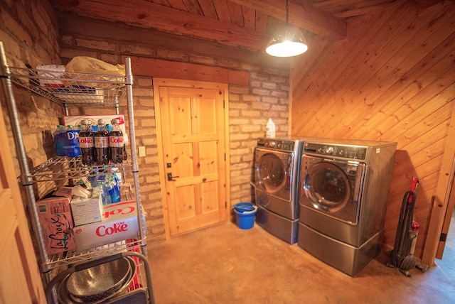 laundry area with carpet flooring, separate washer and dryer, brick wall, wooden walls, and wood ceiling