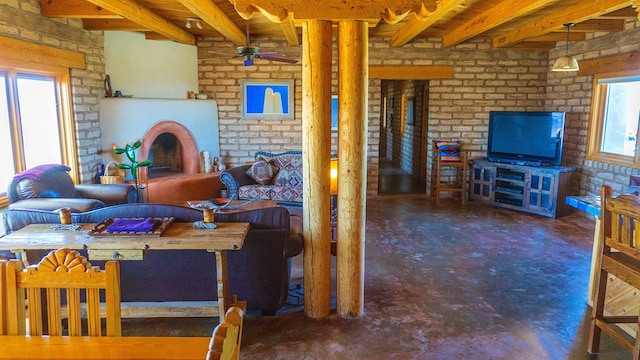 dining space featuring dark carpet, ceiling fan, and brick wall