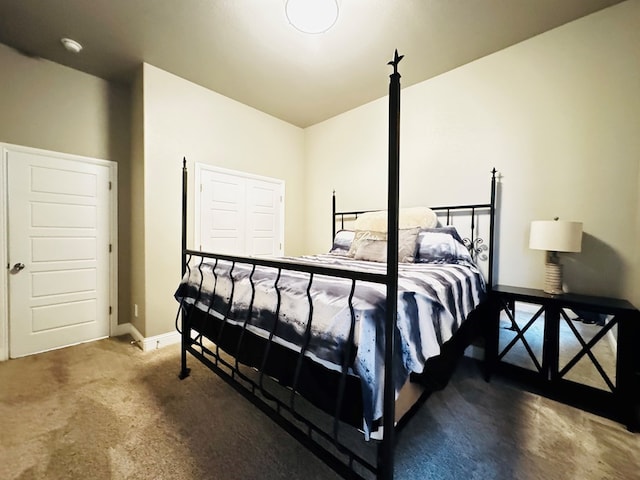 bedroom featuring carpet flooring and baseboards