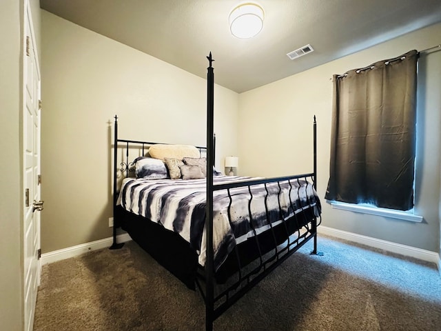 bedroom with carpet flooring, baseboards, and visible vents