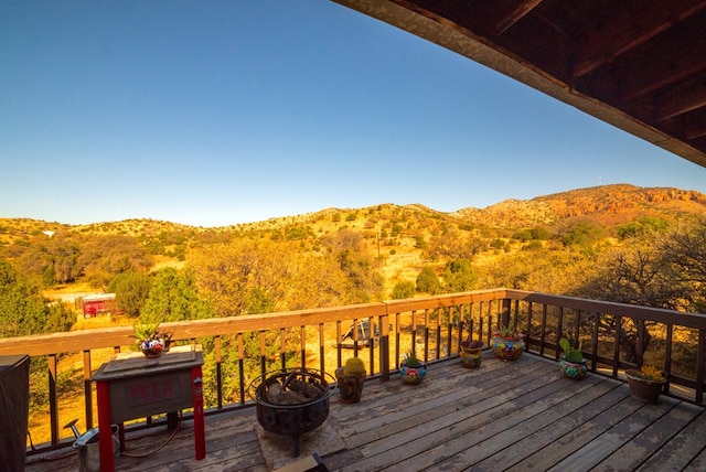 wooden terrace featuring a mountain view