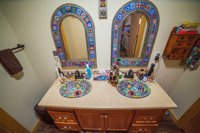 bathroom featuring vanity and wood-type flooring