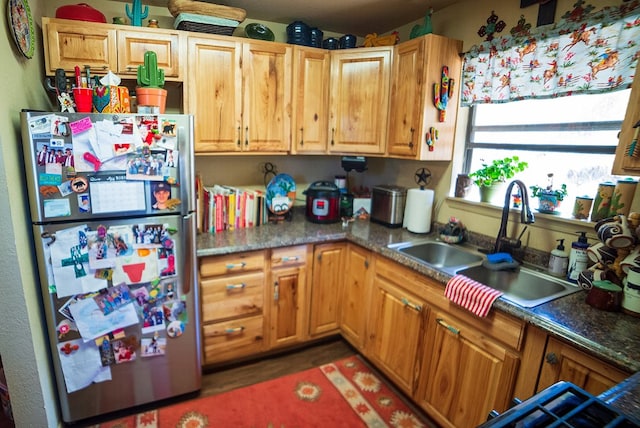 kitchen with stainless steel refrigerator and sink