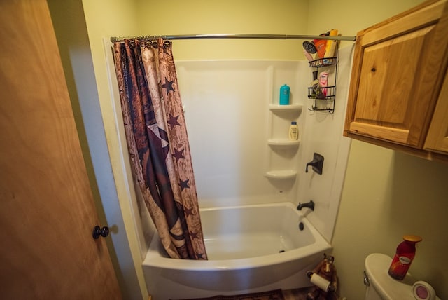 bathroom featuring shower / bath combination with curtain and toilet