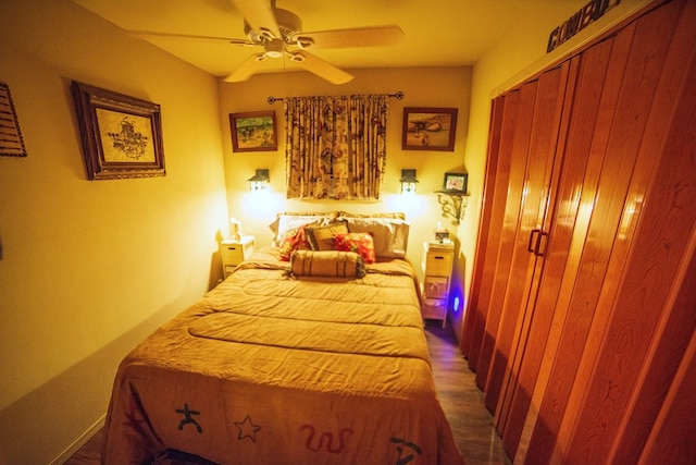 bedroom featuring ceiling fan and a closet