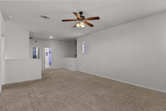 unfurnished room featuring light colored carpet and ceiling fan