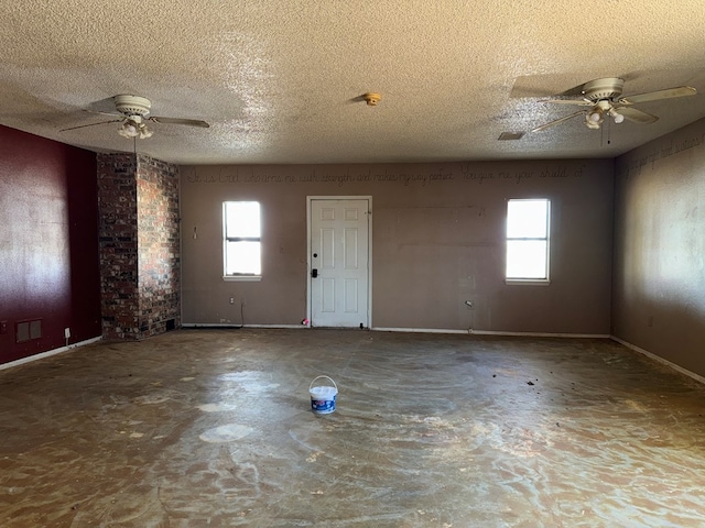 interior space featuring a textured ceiling and ceiling fan