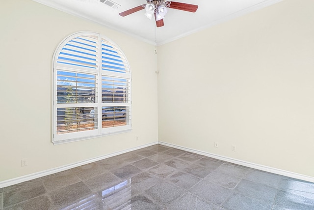 unfurnished room with ceiling fan and crown molding