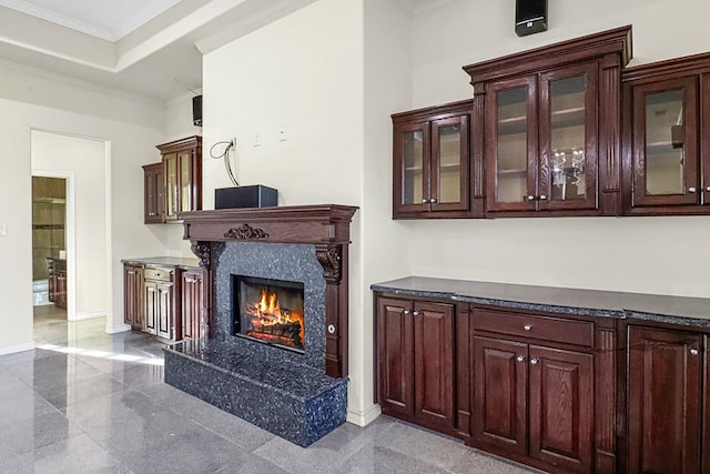 details with ornamental molding and a fireplace