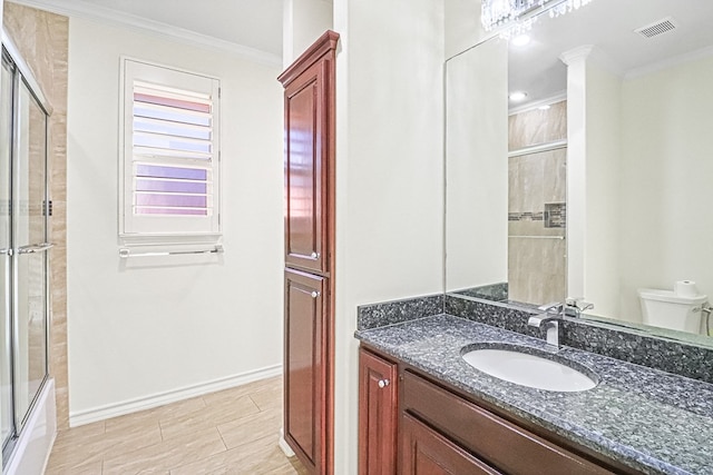 full bathroom with toilet, enclosed tub / shower combo, tile patterned flooring, ornamental molding, and vanity