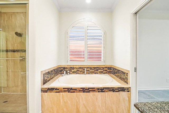 bathroom featuring crown molding and independent shower and bath