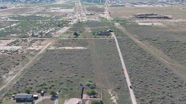 birds eye view of property featuring a rural view