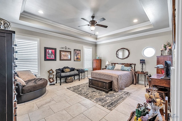 bedroom with a ceiling fan, baseboards, a tray ceiling, recessed lighting, and ornamental molding