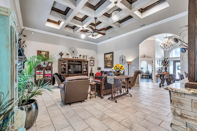 living area featuring visible vents, beam ceiling, a high ceiling, arched walkways, and ceiling fan with notable chandelier