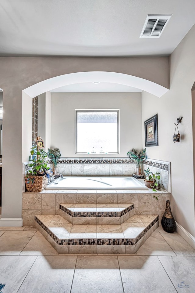 full bathroom with a bath and visible vents