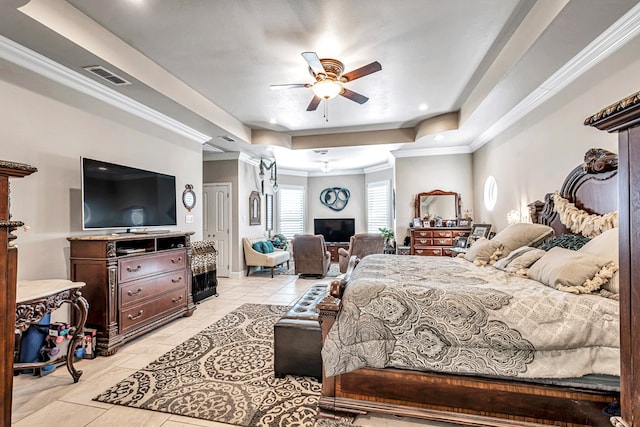 bedroom featuring visible vents, a ceiling fan, a tray ceiling, light tile patterned flooring, and crown molding