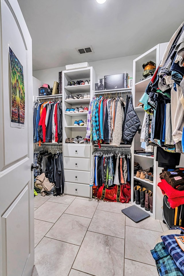 spacious closet featuring tile patterned flooring and visible vents