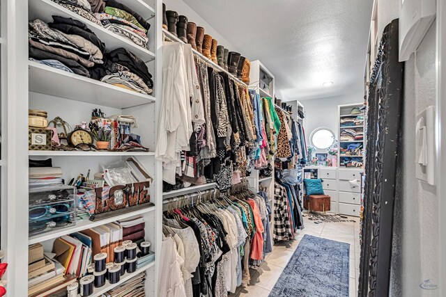 walk in closet featuring tile patterned flooring