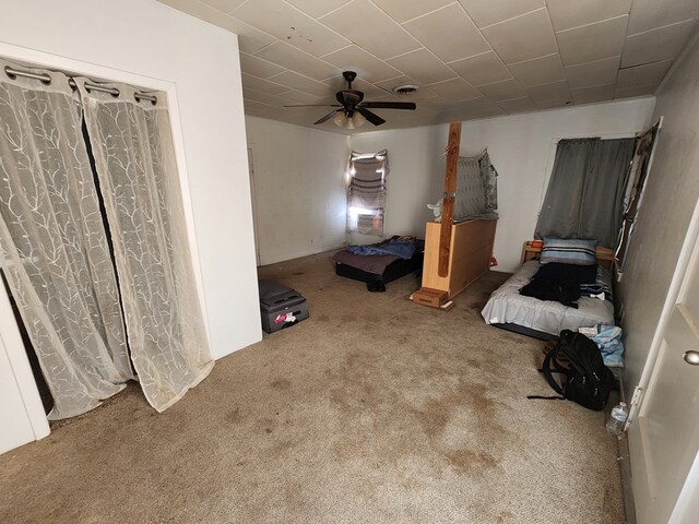 unfurnished bedroom with carpet and ceiling fan