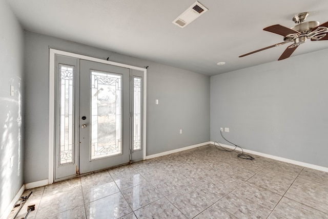 foyer featuring light tile patterned floors and ceiling fan