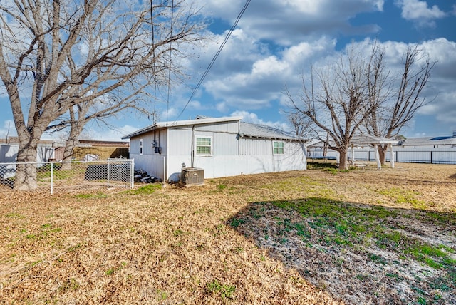 view of side of home featuring a yard