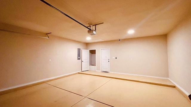 garage with electric panel and a garage door opener