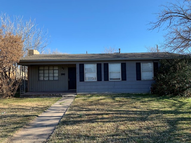 ranch-style house with a front lawn