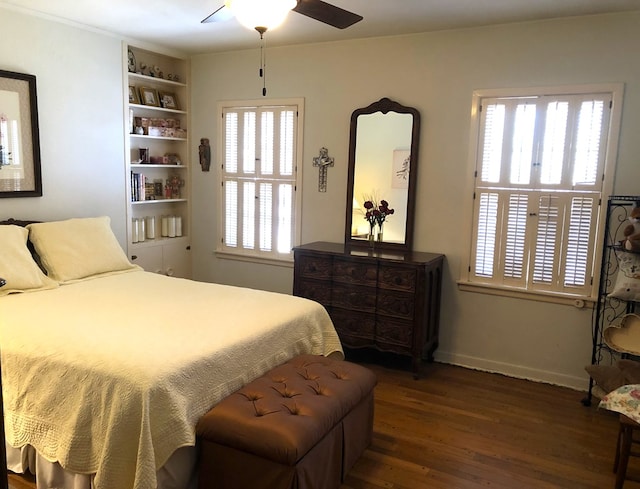 bedroom featuring ceiling fan and dark wood-type flooring