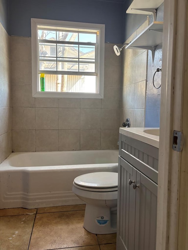 bathroom featuring vanity, toilet, and tile patterned floors