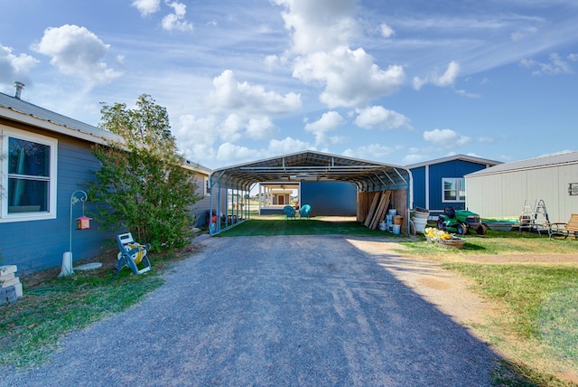 view of vehicle parking with a carport