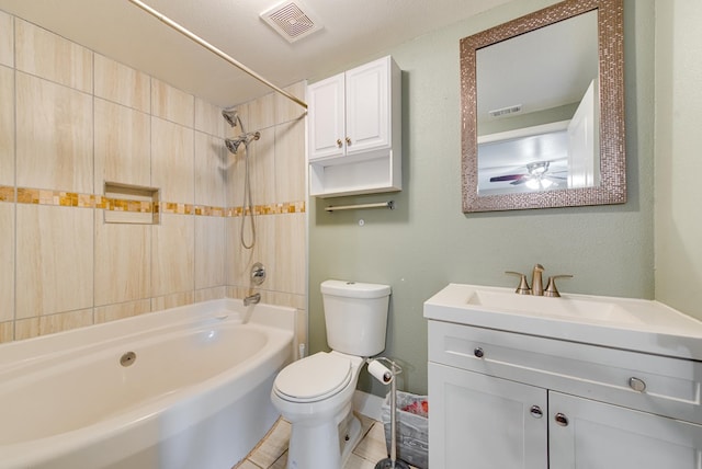 full bathroom featuring vanity, a textured ceiling, ceiling fan, toilet, and tiled shower / bath