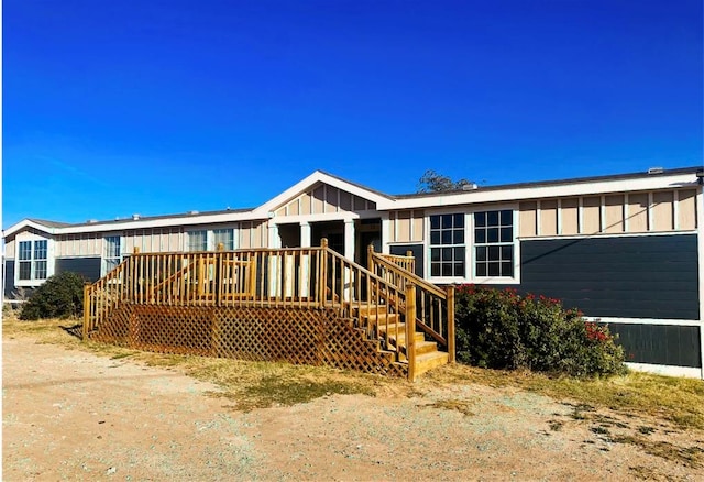 back of house with a wooden deck