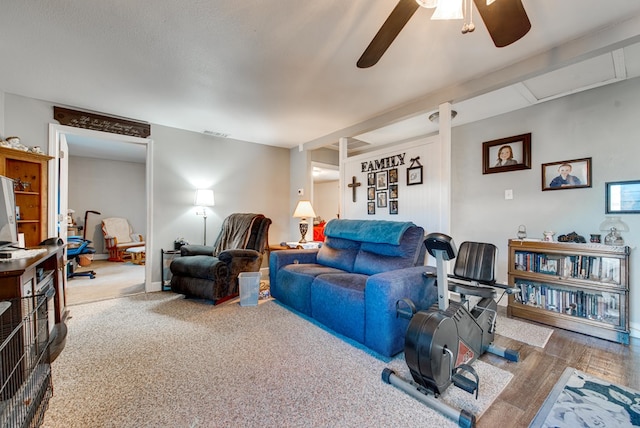 living room with ceiling fan and hardwood / wood-style floors