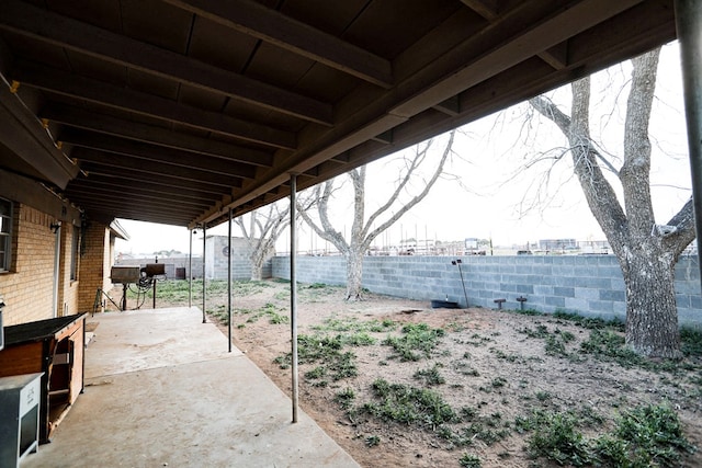 view of yard featuring a patio and a fenced backyard