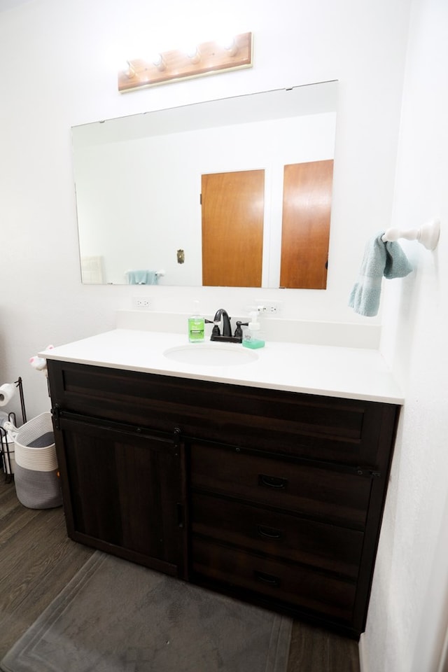 bathroom featuring vanity and wood finished floors