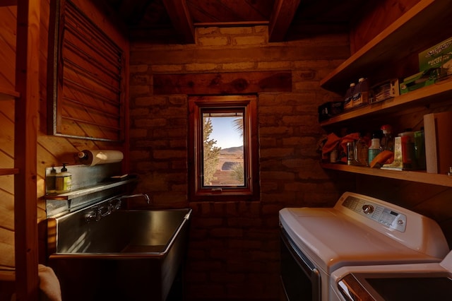 clothes washing area featuring independent washer and dryer