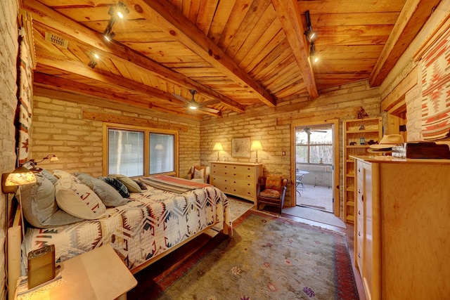 bedroom with vaulted ceiling with beams, wood ceiling, brick wall, and track lighting