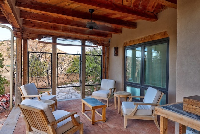 sunroom featuring beam ceiling and wooden ceiling