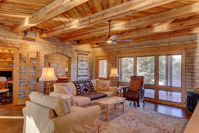 living room featuring beam ceiling, ceiling fan, and wooden ceiling