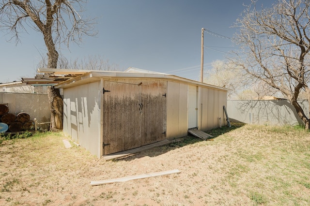 view of shed with fence