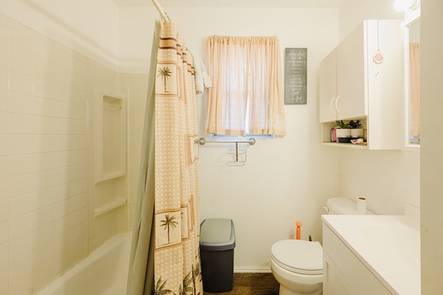 bathroom featuring shower / tub combo with curtain, toilet, and vanity